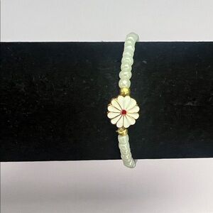 Elegant Gold and White Flower Bracelet